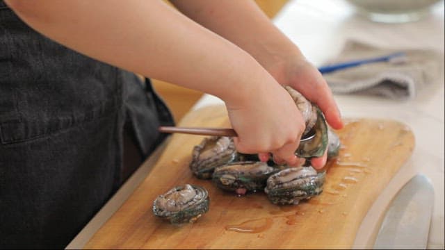 Preparing Fresh abalone on a Cutting Board