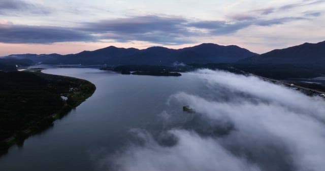 Serene river surrounded by mountains