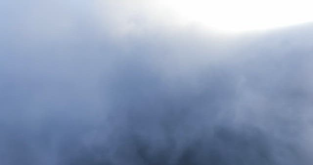Clouds covering a mountain peak