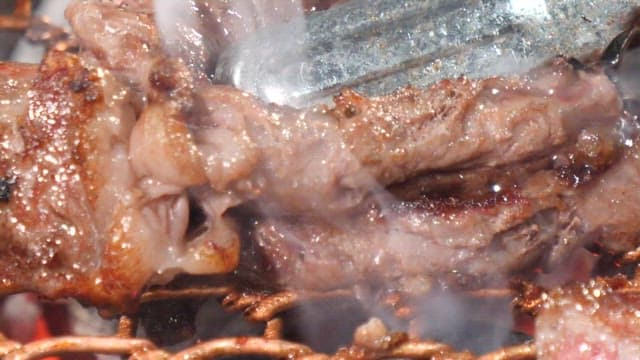 Sizzling beef on a grill