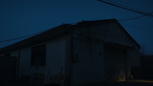 Figure emerging from an old warehouse