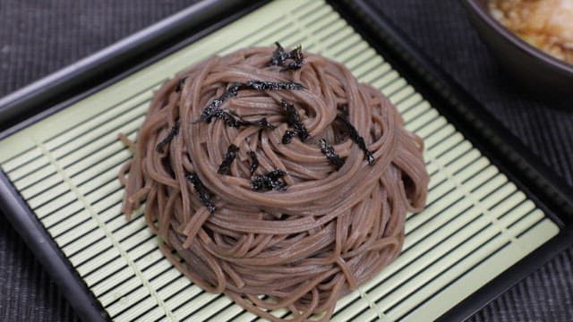 Cold soba served with buckwheat noodles and broth