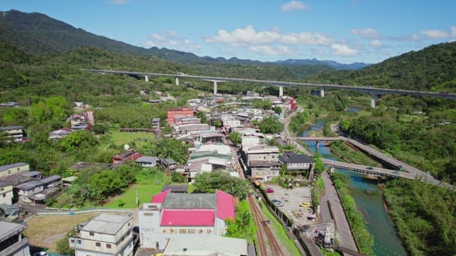 Scenic view of a town surrounded by mountains