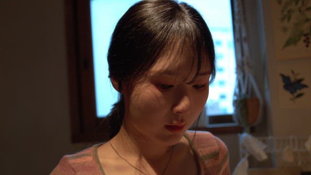 Woman checking the seasoning in the kitchen