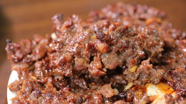 Grilled short rib patties on a plate