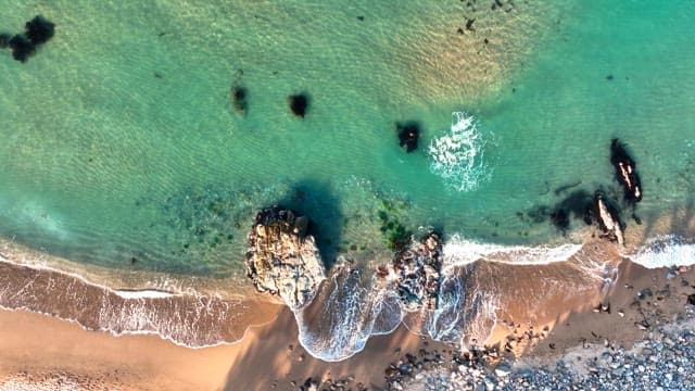 Waves crashing on a sandy beach