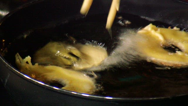 Frying apple batter in hot oil