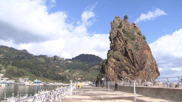 Pier with Big Rocks on a Sunny Day