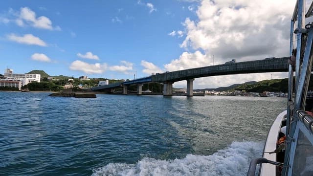 View of a bridge over the sea from a boat