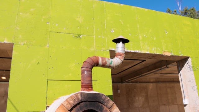 Outdoor brick oven with fire burning