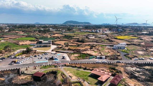 Rural farmland landscape with fields and wind turbines