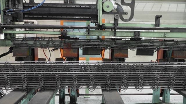 Metal wires being processed in a factory