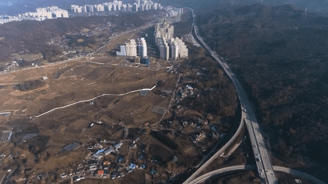 Overhead View of Highway Interchange Near Urban Area