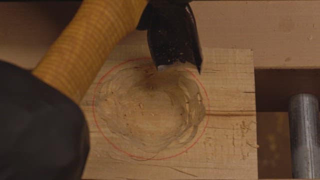 Wood carving with a chisel