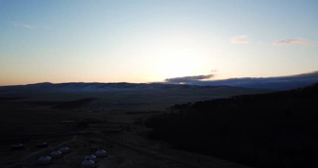 Sunrise over a vast mountain landscape