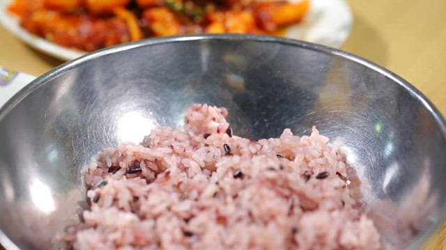 Korean meal with stir-fried squid and pork, rice, and soybean paste stew