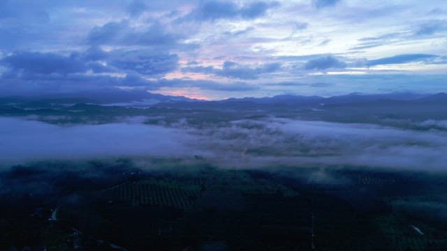 Misty mountains at dawn with a colorful sky