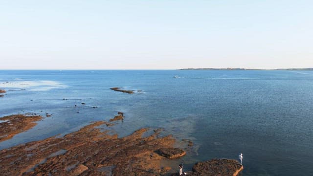 Calm sea with distant islands