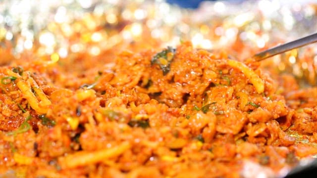 Spoonful of stir-fried rice mixed with bean sprouts, pork bulgogi