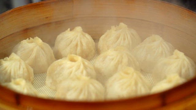 Steaming Hot Dumplings in Bamboo Steamers