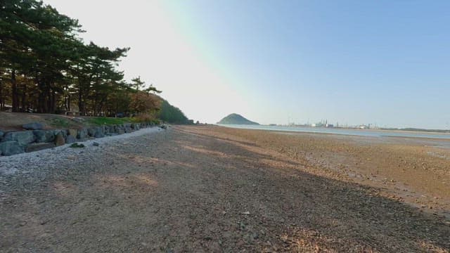 Serene beach with distant mountains