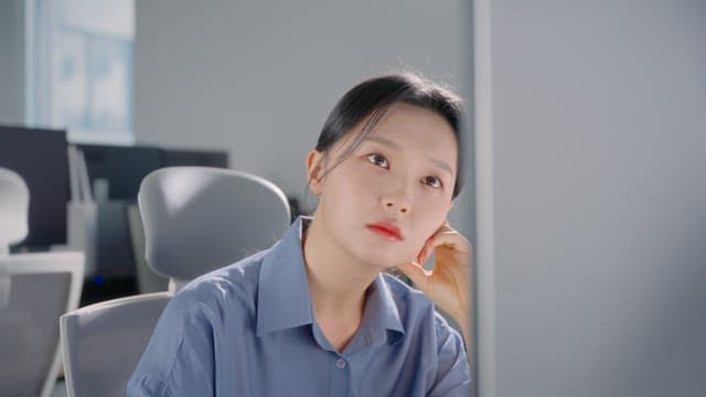 Woman in an office looking at a screen