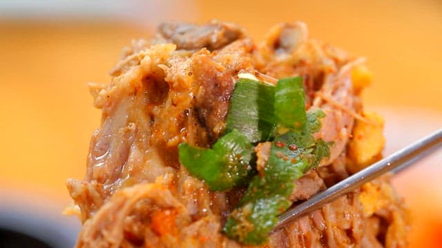 One chopstick of pork backbone stew meat with vegetables