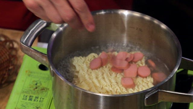 Ramyeon with sausage being prepared