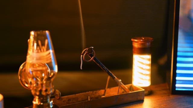 Incense coil with a wick burning under warm and cozy lighting