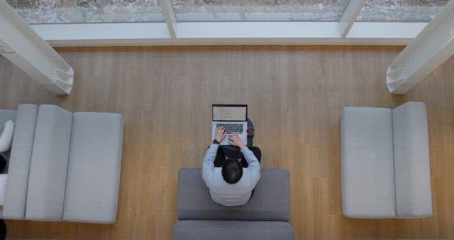 Overhead View of a Person Working on Laptop