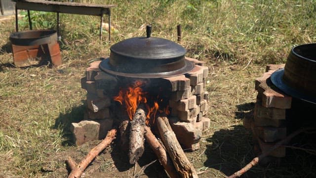 Outdoor cooking with a firewood stove