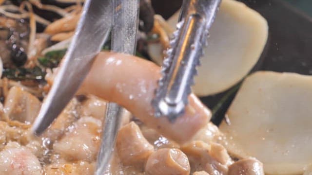 Cooking chitterlings on a hot grill