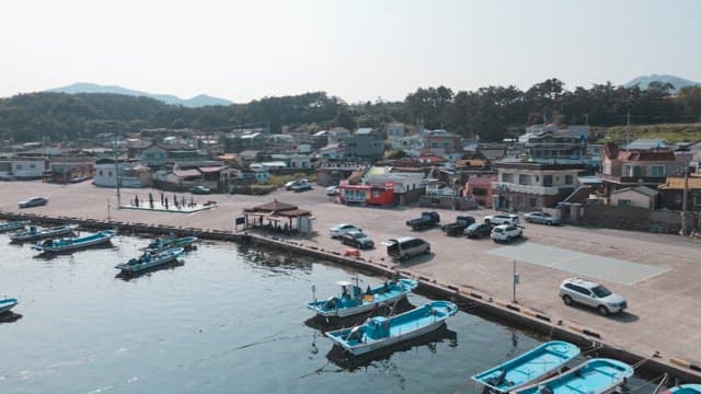 Peaceful fishing village with fishing boats anchored