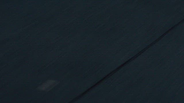 Asphalt road surface seen from a moving vehicle