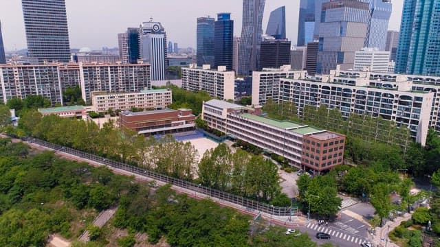 Overlooking a School in a Bustling City