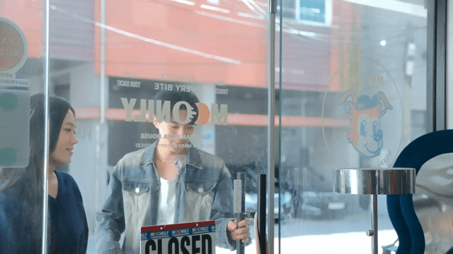 Couple entering a pizza shop