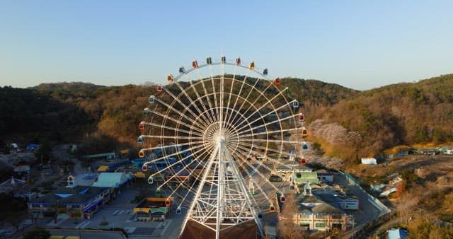Ferris wheel in a serene amusement park at dusk