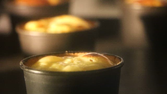 Yellow food boiling inside a metal container