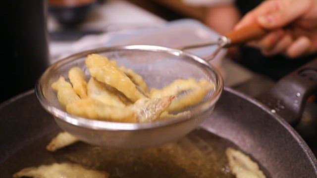 Preparing fried food in a kitchen