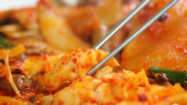 Spicy braised fish with chopsticks