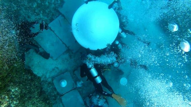 Divers setting up an underwater structure