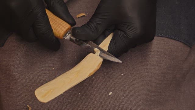 Carving a wooden spoon with precision