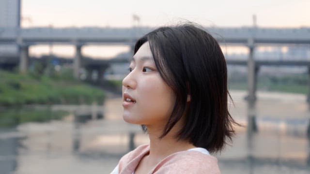 Woman smiling by the riverside