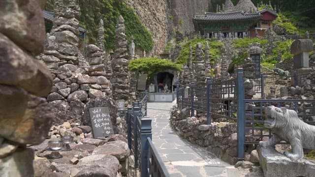 Serene Temple Entrance with Stone Stacks