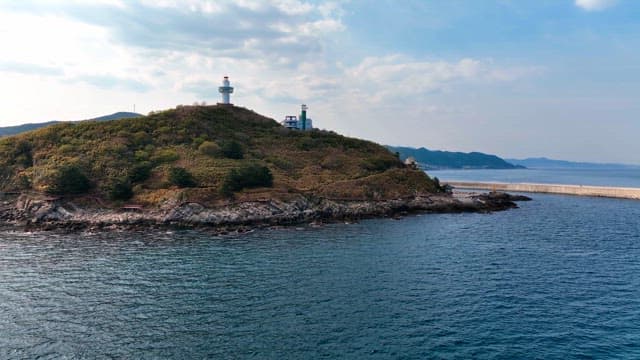 Scenic island with a lighthouse by the sea