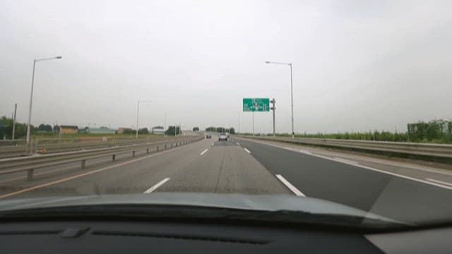 Driving on a Highway on an Overcast Day
