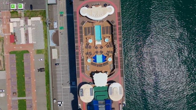 Cruise ship docked at the harbor on a sunny day