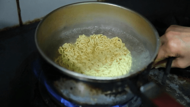 Instant noodles boiling in a pot