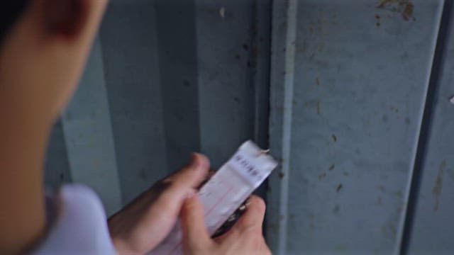 Person Choosing the Right Key for a Lock