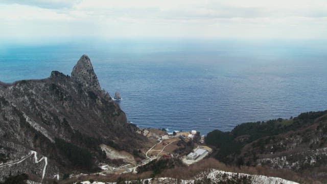 Snowy Coastal Cliffs Overlooking the Ocean